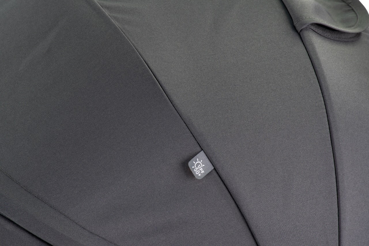 Close-up of a gray fabric surface with a brand logo on it